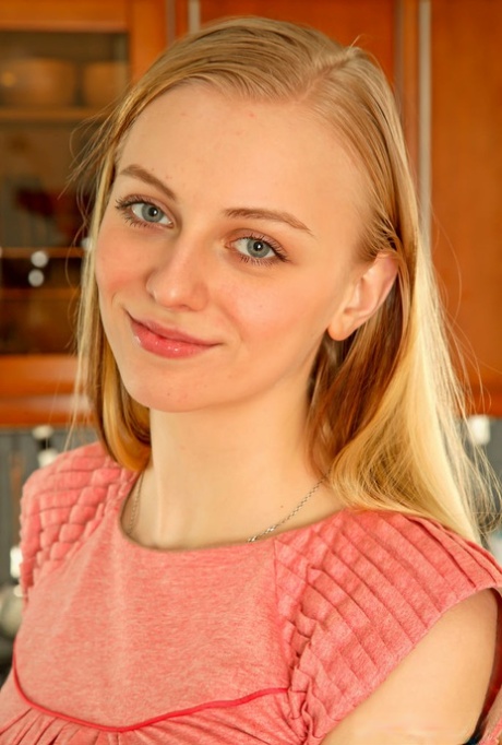 18 year old blonde Josephine K removes her dress for confident nude poses 15650597