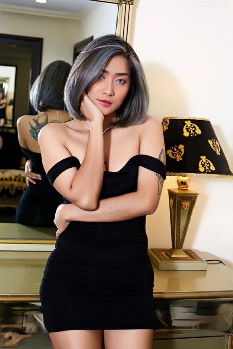 Tattooed Asian babe looses her tiny tits and pussy from a little black dress 52501294