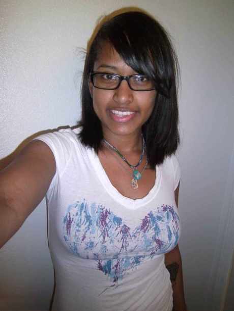 Ebony amateur takes self shots of her big tattooed boobs and bald vagina 60443517