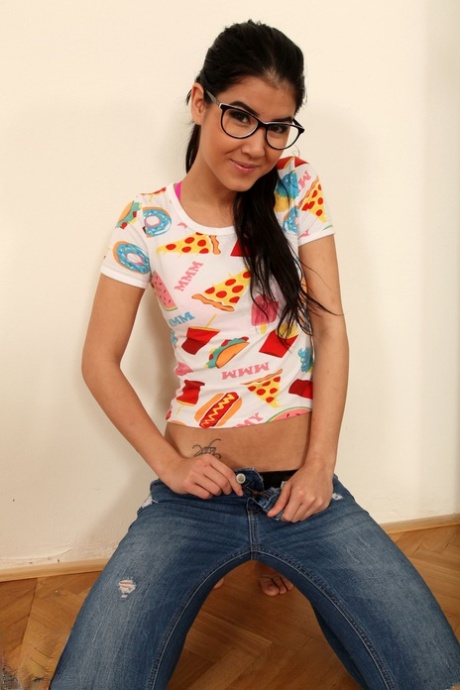 Slim brunette Lady Dee removes her glasses and then her clothing in a bedroom 45275038