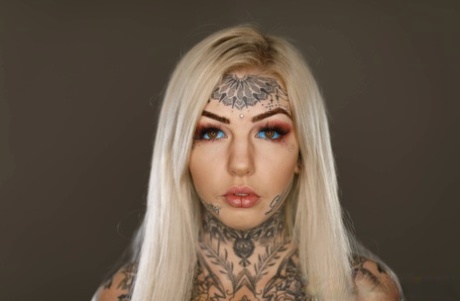 Heavily tattooed blonde Amber Luke models a bra and thong ensemble 34896770
