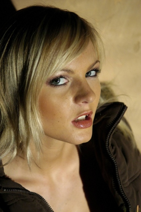 Beautiful blonde Sandra Sanchez casually frees her small tits from a bra 22885067