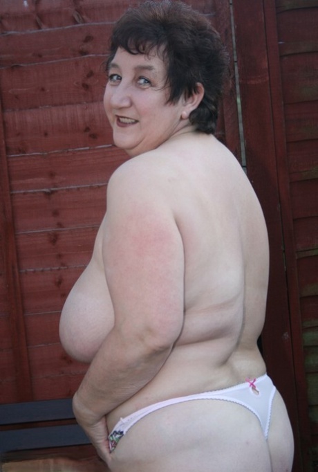Fat granny Kinky Carol gets naked on a patio bench in over the knee boots 94955918