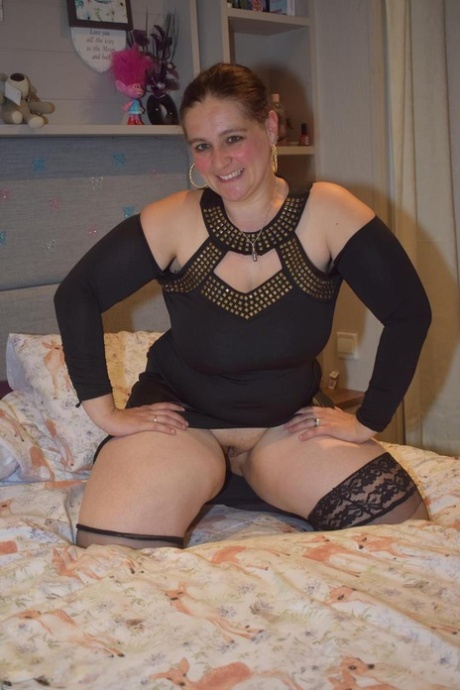 Middle-aged BBW gets completely naked on top of her bed for her first nudes 49740207