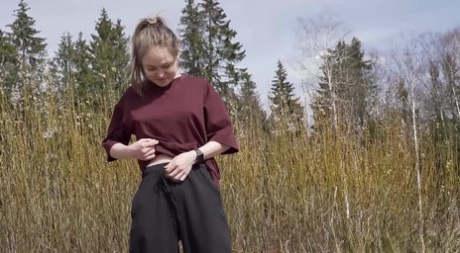 Fair skinned blonde Nastya takes a pee while hiking in the countryside 93276635
