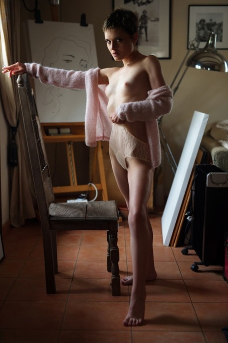 Alluring girl with short hair Caterina Correia smokes while going topless 26612359