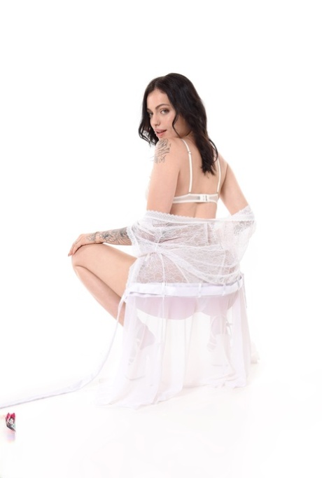 Tattooed brunette Clara Mia masturbates with a vibrator after disrobing 87205075