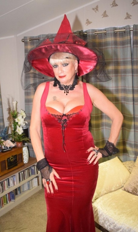 Mature blonde Dimonty frees her tits and snatch from a witch outfit 23279463