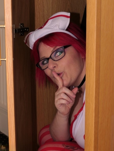 British nurse Mollie Foxxx displays her shaved pussy while wearing sexy nylons 45025933