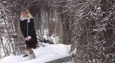 Blonde girl Jessy gets caught taking a piss upon snowy ground 53578656