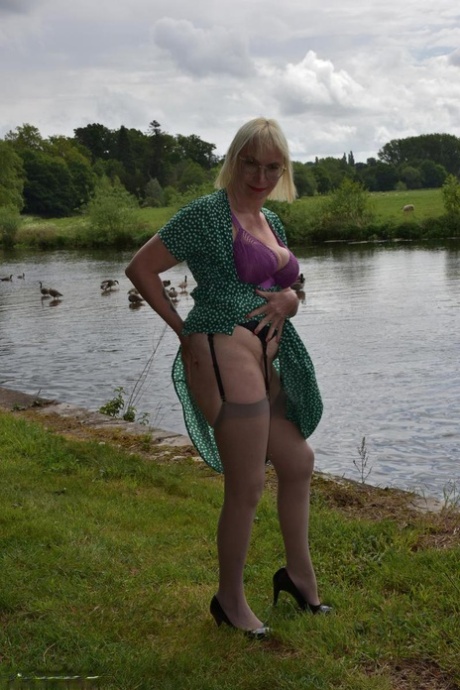Older blonde Barby Slut flashes her tits and pussy while out in the country 58607965