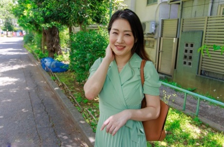 Japanese wife Megumi Satuki kisses her husband goodbye before sex with a boy 57693821