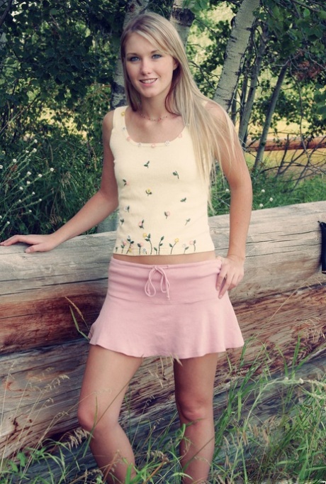 Beautiful blonde Jewel shows her tits and ass near a stand of birch trees 97709522