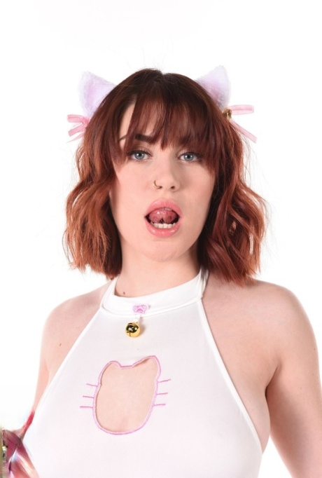 Cute redhead Carla Vyxx displays her pierced tongue before going nude in heels 55676270