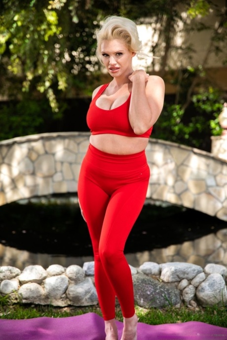 Blonde cougar Charli Phoenix gives a blowjob in a backyard environment 47060638