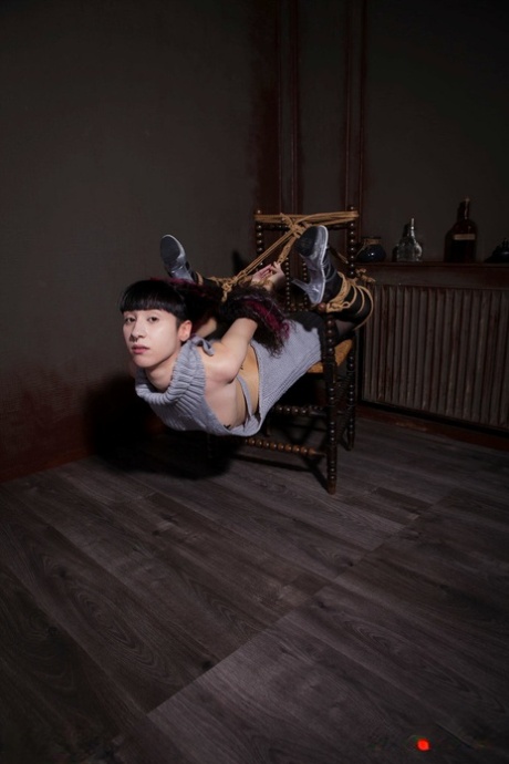 Solo girl Carmineworx is tied to a chair in a highly uncomfortable position 97678334