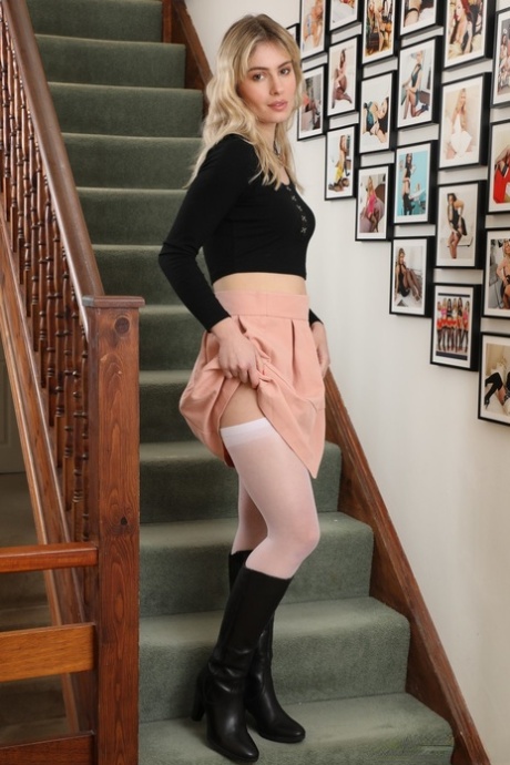 Beautiful blonde Pippa Doll strips to a garter belt and white nylons 18711959