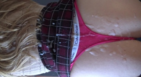 Blonde girl takes a big cumshot on her thong covered butt 94417218