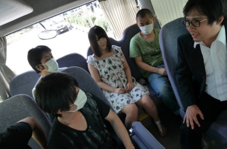 Japanese girl Tsuna Kimura frees her tiny tits during a blowbang on a bus 14544542