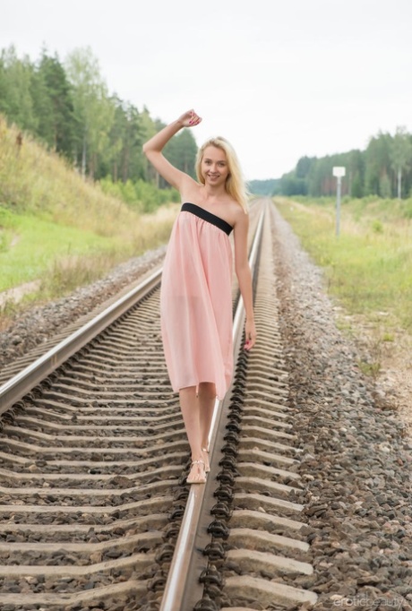 Nice blonde teen Bernie gets completely naked on railway tracks 51732394
