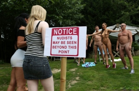 British girls give CFNM handjobs after coming upon a bunch of nudists 96350297