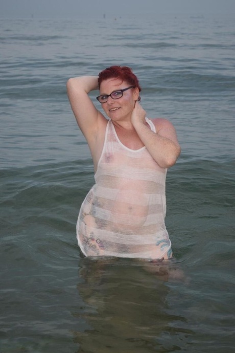 Mature UK redhead Mollie Foxxx exposes her tits and pussy while in the ocean 34265812