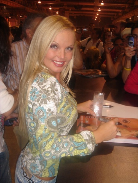 Sexy pornstar MILF Silvia Saint posing fully clothed in jeans and boots 12461541