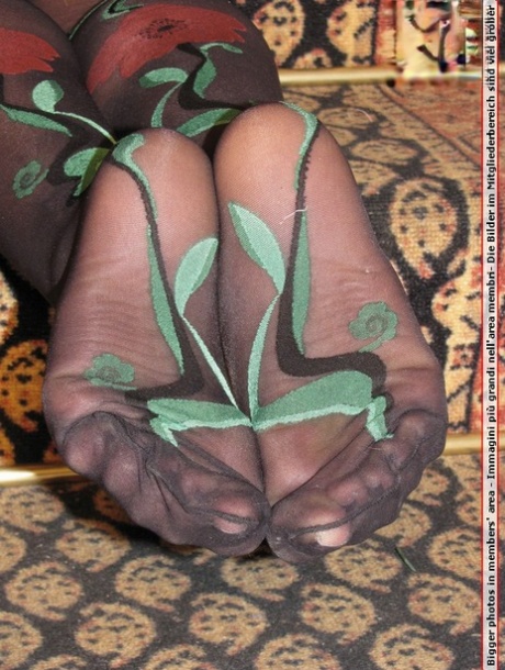 Clothed female kicks off her black pumps in the sexiest of nylons 14212544