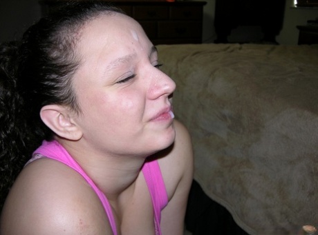Clothed amateur takes a cumshot on her face after tugging on a nude man's dick 32296061