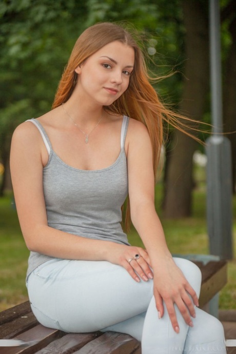 Redhead European babe undressing to bare tiny teen tits during glam shoot 29808869