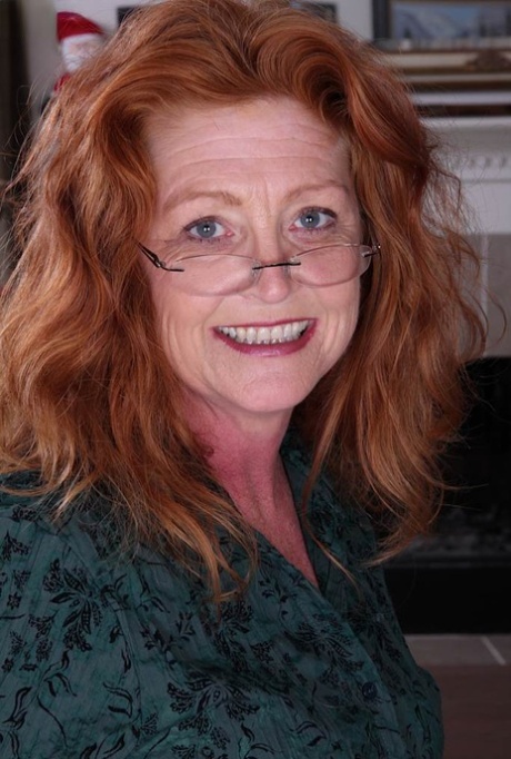 Old lady Veronica Smith joyfully shows off her aging assets on her desk 20796802