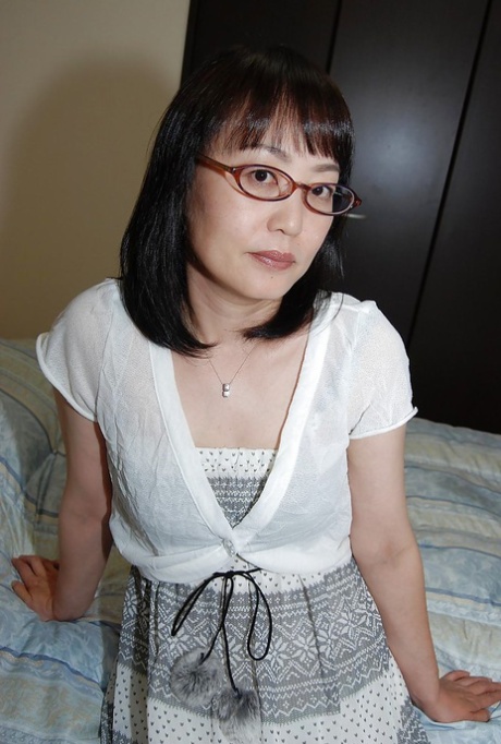 Shy asian lady in glasses strips down and has some pussy vibing fun 85398587
