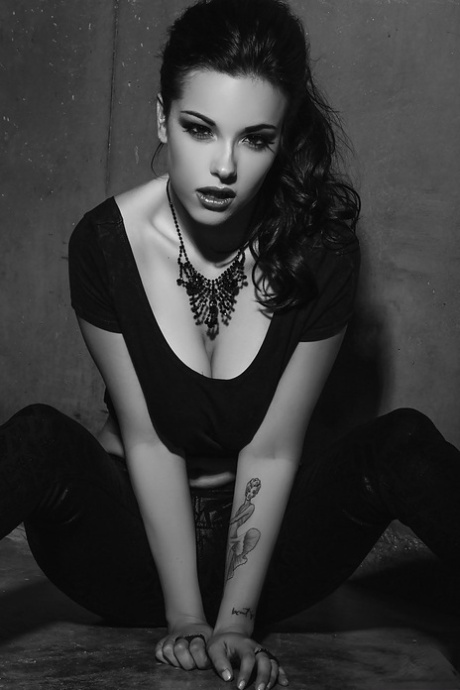 Busty brunette with shaved cooter undressing for a black and white shoot 57211461