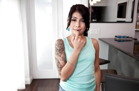 Tattooed brunette Latina solo girl Sadie Pop strutting in socks and shorts 11145397