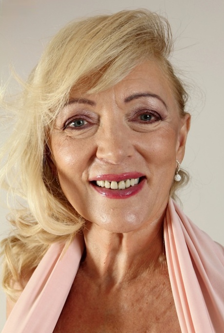 Mature blonde woman Janet Lesley revealing saggy tits and shaved vagina 91390582