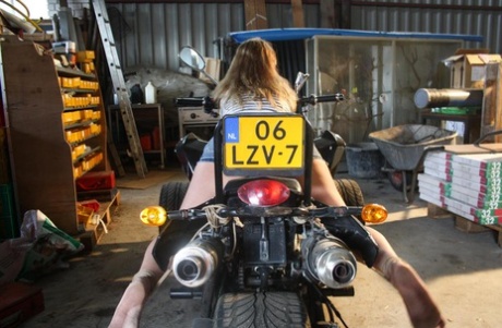 Blonde female DD is left ball gagged and rope bound atop a 3 wheeler 97481807