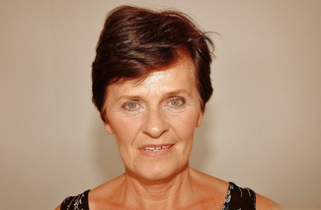 Short haired granny in stockings stripping off her dress and lingerie 18860781