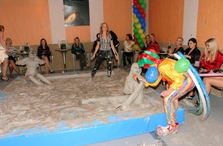 Seductive fetish ladies get involved in fully clothed mud wrestling 14397244