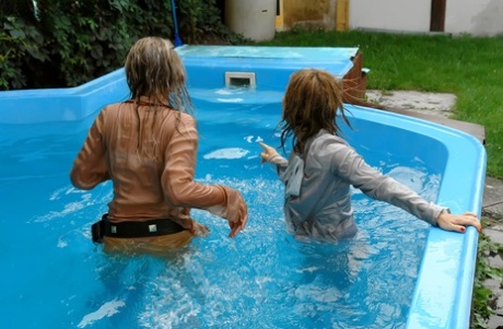 Tatiana Milovani has some fully clothed fun with her friend in the pool 35973364