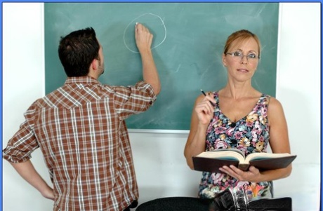 Mature teacher in glasses Nicole Moore pleasuring cock with her boobs 56450122