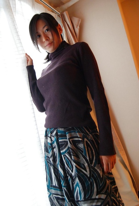 Asian MILF Ryoko Morikawa undressing and exposing her hairy gash in close up 30859261